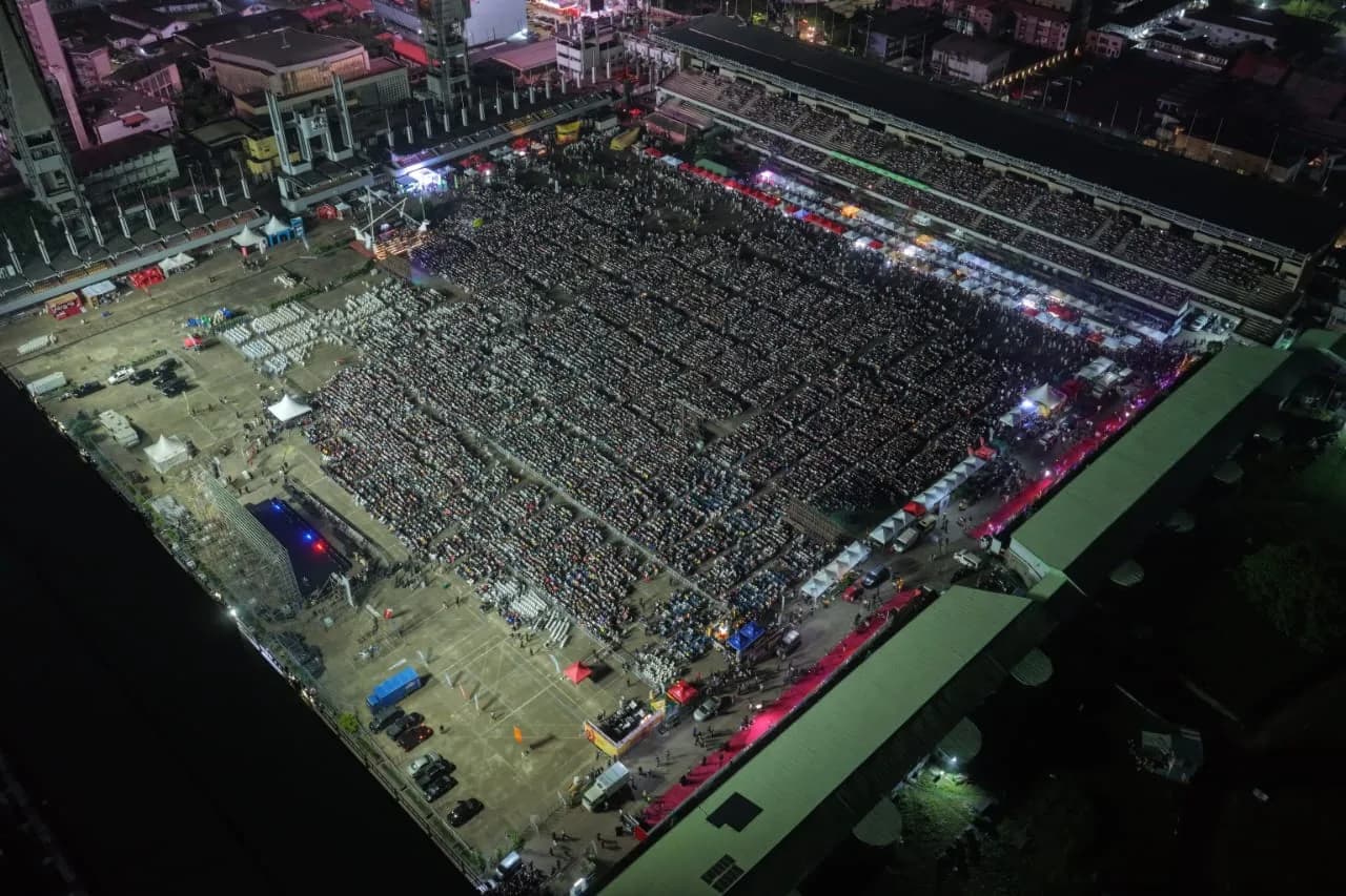 The crowd and illuminated stage at the Black Market screening in Lagos.