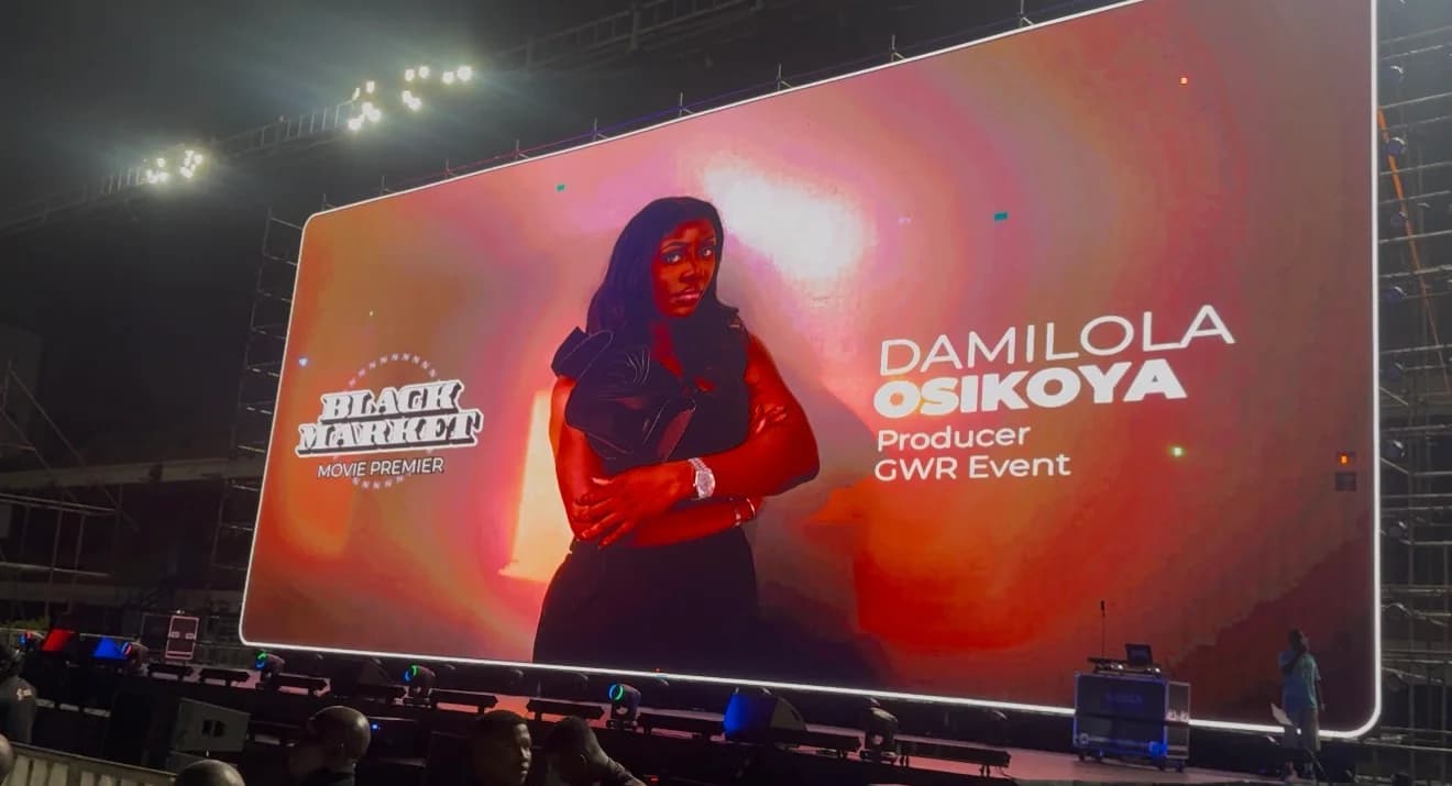 The Black Market premiere screen recognising Damilola Osikoya as producer of the Guinness World Records event.